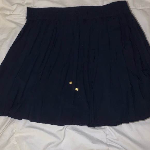 Blue skirt with gold tipped strings - Picture 1 of 1